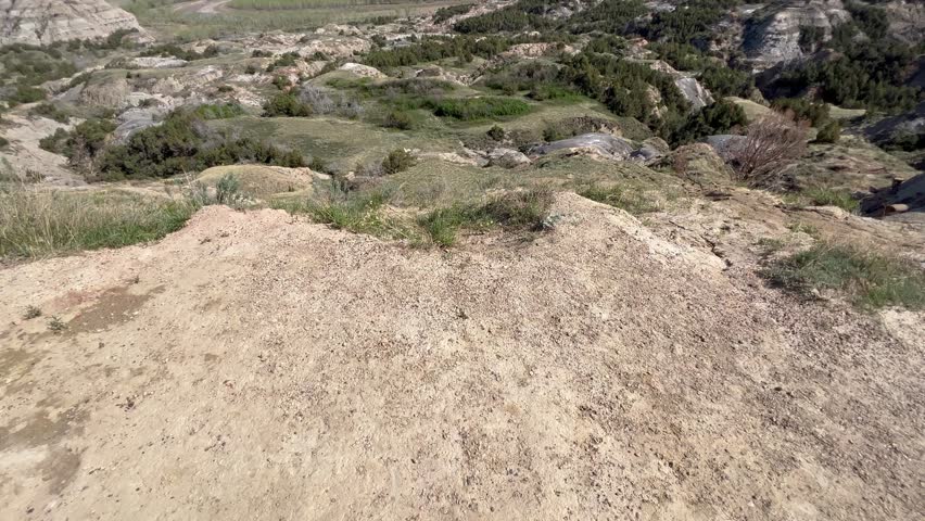 Panning up on  the  badlands hills and mountains in Theodore Roosevelt National Park in North Dakota.