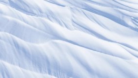 Video ofl natural winter snow texture of frozen Baikal Lake in cold day. Abstract white and blue textured background of snowy ice. Structure of frozen waves or weathered sastrugi. Mock up, copy space