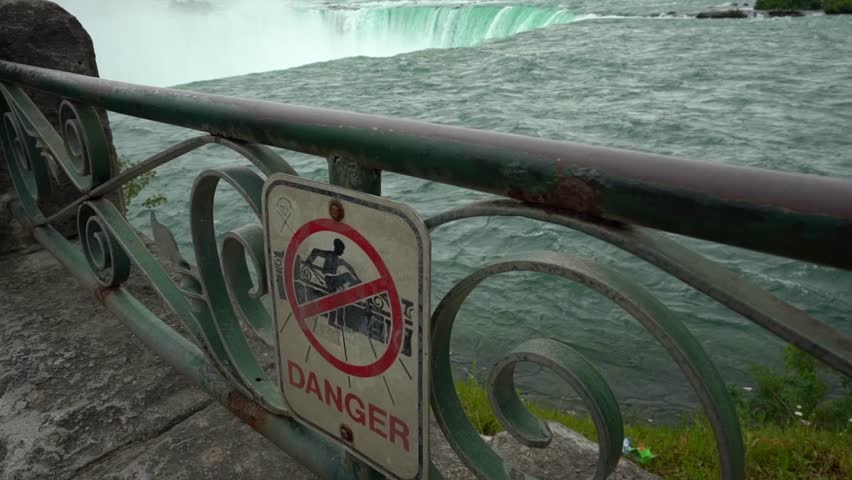 Danger Sign On Fence At Niagara Falls, Travel Attraction In Canada