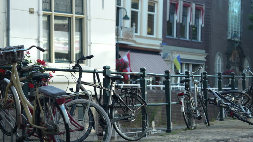 Bicycles On The Bike Rack In The Sidewalk In Westhaven, Gouda, Netherlands. - wide