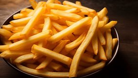 Golden and irresistible a top view close up of French fries 3d Motion footage for background