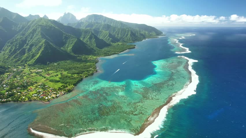 Aerial Tahiti. surfing in Teahupoo. Exotic tropical island, ocean, mountains. Drone  French Polynesia. Teahupoo is a famous surfing destination near Papeete. Adventure travel.  Royalty-Free Stock Footage #1109865369