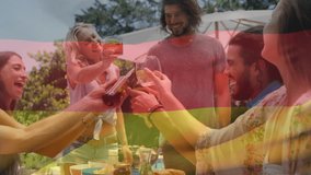 Composite video of germany flag over diverse friends toasting drinks while having lunch in the park. Patriotism, road trip and camping concept