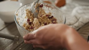 Cookie. A caring mother in loungewear responsibly kneads cookie dough on the kitchen table. A woman who follows proper nutrition prepares dough at home, uses kitchen utensils, muesli - Powered by Shutterstock - Get 15% off with code: PIKWIZARD15