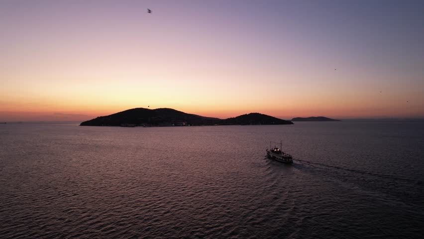 Aerial view of Prince Islands in Istanbul at sunset. Istanbul, Turkey. Ferry goes to the island at sunset. Drone shot. Royalty-Free Stock Footage #1109896843