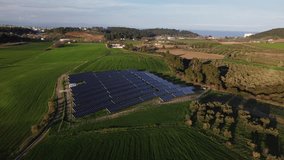 Solar panels in an agricultural field. Aerial drone video.