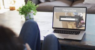 Knees of woman at table using laptop, online shopping for beauty products, slow motion. Retail business, sale, communication and digital interface digitally generated video.