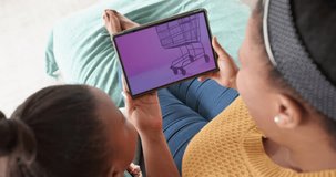 African american mother and daughter using tablet, online shopping on cyber monday, slow motion. Retail business, sale, communication and digital interface digitally generated video.