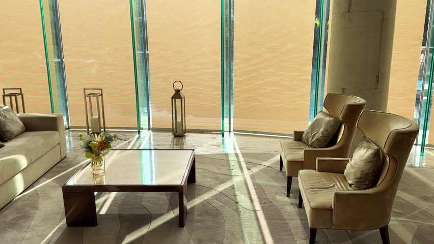 Luxurious Home Interior with Elegant Furniture, Pool Reflections on Windows, and Sunlight Streaming Through