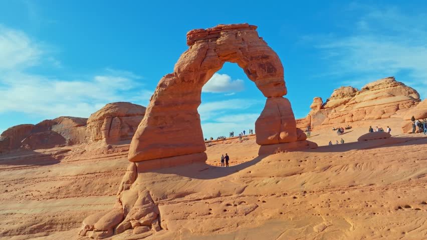 Delicate Arch With Tourists At Arches National Park, Utah - aerial shot