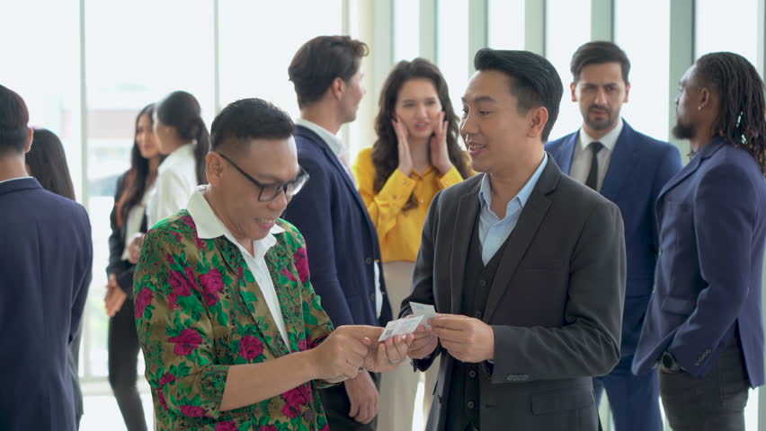 group of diversity business people shaking hands and greeting each other Exchanging Business Cards after a meeting conference or seminar. Communication in Corporate at office. connecting people. asian Royalty-Free Stock Footage #1109908995