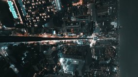 Epic aerial shot modern city skyline, vertical video. Aerial view of night city with buildings roads with cars of modern metropolis. Night cityscape captured by drone. Night cinematic Bangkok - Powered by Shutterstock - Get 15% off with code: PIKWIZARD15