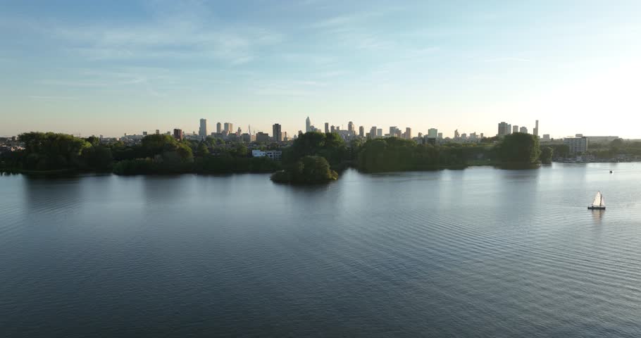Revealing view on the skyline of Rotterdam, The Netherlands, from above of the Kralinsge Plas. Royalty-Free Stock Footage #1109915781