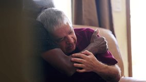 Depressed senior being consoled by friend's embrace. Candid scene of older person struggling with problems, HELP and SUPPORT during old age - Powered by Shutterstock - Get 15% off with code: PIKWIZARD15