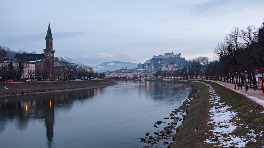 Day to night hyper lapse Salzburg old town, Hohensalzburg Fortress, Salzburg Christuskirche and Salzach riverside, Austria.