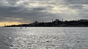 Panoramic Istanbul view nostalgia cruise ship going in the middle of the sea sky majestic amazing grey cloudy sea grey Sultanahmet peninsula silhouette tourism travel sightseeing holiday Istanbul Turk