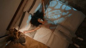 Top view nighttime bedroom happy relaxed African American woman falling down on cozy comfortable bed satisfied tired girl teen lying on soft mattress bedtime rest recreation fall asleep relax sleeping - Powered by Shutterstock - Get 15% off with code: PIKWIZARD15