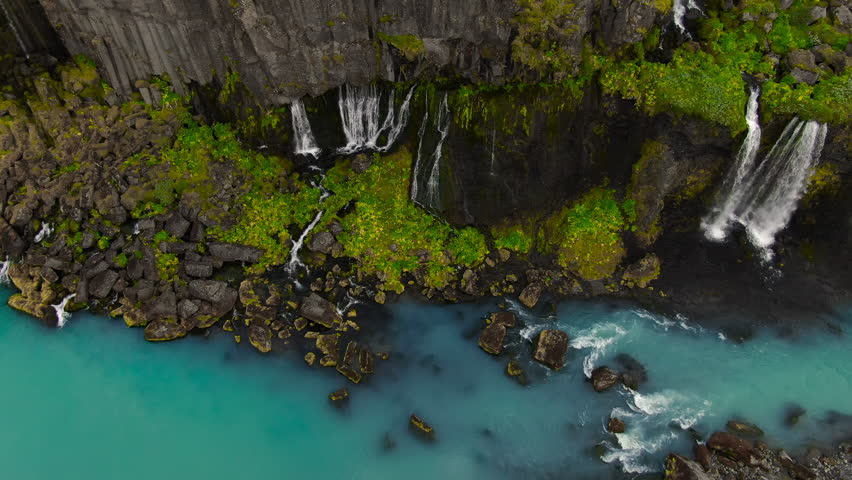 fantasy like canyon valley of tears with several waterfalls falling in the blue river with lush nature in the desertic lava landscape Sigoldugljufur iceland
 Royalty-Free Stock Footage #1109927553