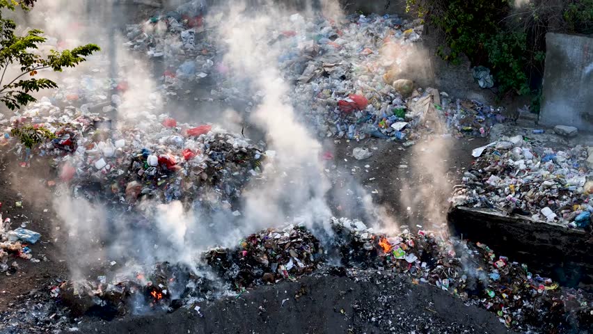 burning rubbish in landfills. managing waste that is a source of smoke, toxins that cause air pollution, environmental damage and global warming. Royalty-Free Stock Footage #1109930989
