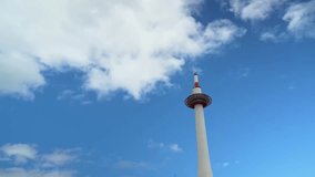 Time lapse blue sky and cloud in summer season with Kyoto tower, landmark of Kyoto