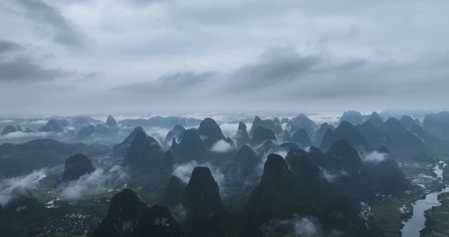 Aerial Video of Guilin Landscape，In the morning, the clouds and mist shrouded in mist，Karst topography，Guilin China Royalty-Free Stock Footage #1109940405