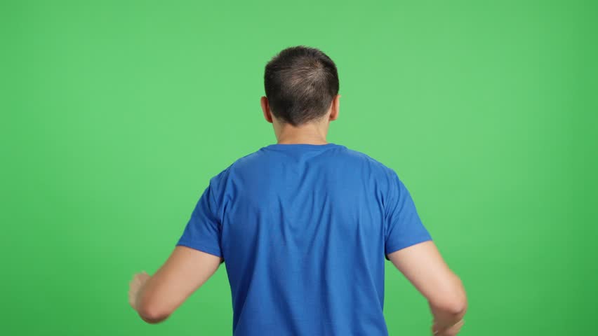 Rear view of a man waving a japanese pennant