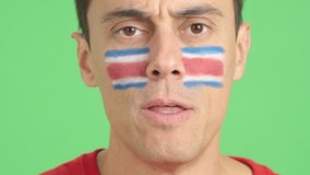 Close up of a man supporting costa rican team
