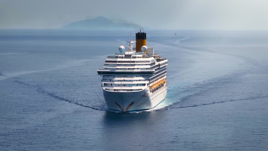 Aerial front view of a generic cruise ship traveling over calm ocean Royalty-Free Stock Footage #1109946419
