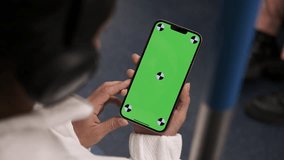 Woman using smartphone with vertical green screen display watching content. Browsing social network, news. Girl in subway using smart phone internet surfing communication online. Public transport - Powered by Shutterstock - Get 15% off with code: PIKWIZARD15
