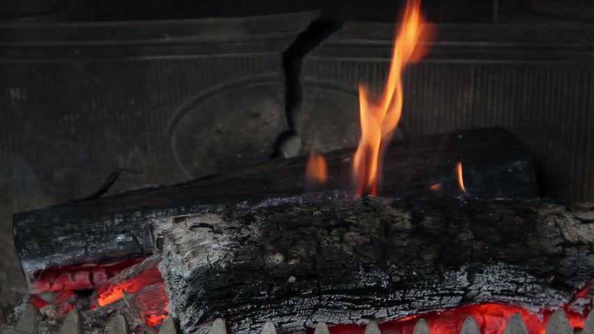 Fireplace - View at the fire in the fireplace. Closeup 