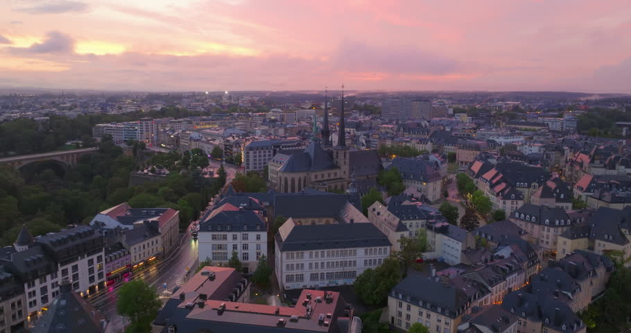 Flying a drone over the historical center of Luxembourg city in the summer in the evening at sunset Royalty-Free Stock Footage #1109951653
