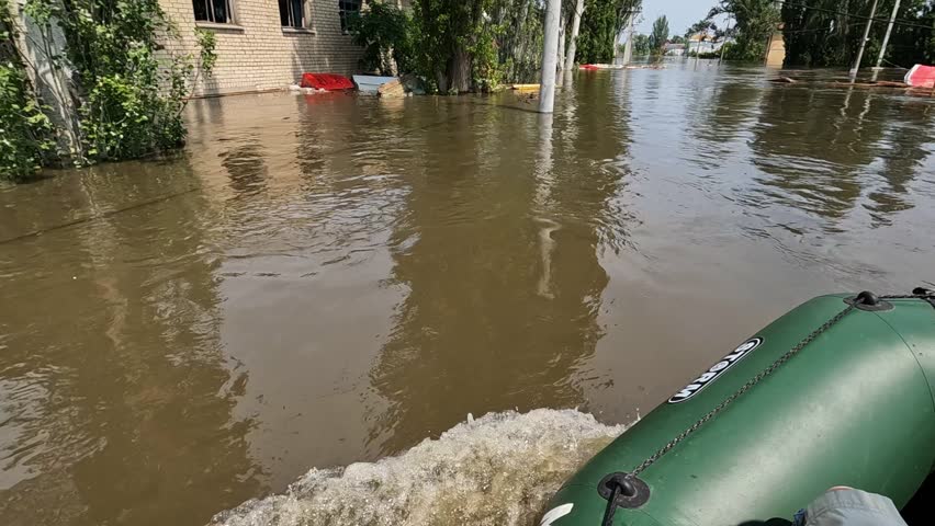 Flooding in Kherson town as a result of the explosion of a dam on the Dnipro river in city of Novaya Kakhovka. Consequences of the detonation of Kakhovka Hydroelectric Power Station. War in Ukraine.