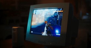 Close Up Of Old Desktop Computer With 3D First-Person Shooter Video Game In Retro Garage Late At Night In Nineties. Dated PC Of Gamer Running Popular Game With Character Playing Against Enemies.
