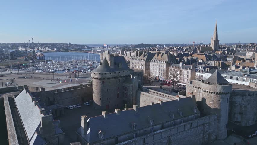 Saint-Malo Castle and cityscape, Brittany in France. Aerial sideways Royalty-Free Stock Footage #1109960621