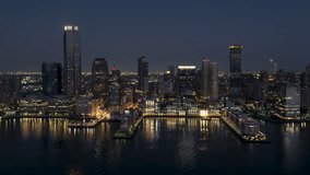 Establishing Aerial View Shot of Jersey City, New Jersey, NJ, United States, super clear image, night evening dawn dusk, waterfront