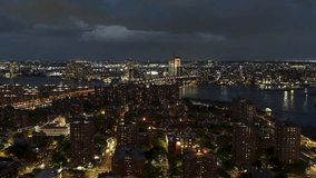 Establishing Aerial View Shot of New York City NY, NYC, United States, super clear image, night evening dawn dusk, track in, Brooklyn Green Point seen from Manhattan, Williamsburg Bridge