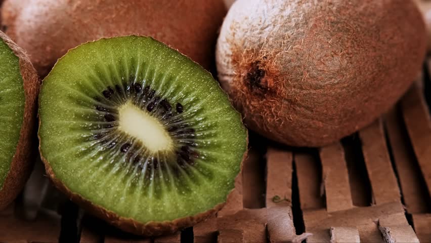 ripe kiwi on a straw background. detoxifying smoothie ingredient