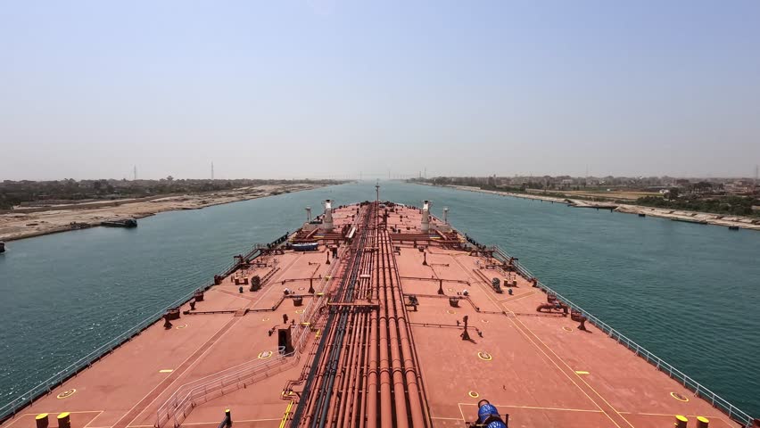 Timelapse oil tanker max bow transit crossing Suez canal sunny day