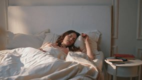 Stressed woman awaking early morning. Shocked girl oversleep looking smartphone missed alarm clock. Beautiful frustrated female getting up panic on Monday. Anxious model waking up check mobile phone - Powered by Shutterstock - Get 15% off with code: PIKWIZARD15