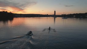 Quadruple Scull Boat with four Rowers Prepares to Compete in a Race. Sports Canoe with a Young Team of Athletes Training in an Ocean Bay at Sunset. Aerial View of a Crew Racing Shell Being Rowed.  - Powered by Shutterstock - Get 15% off with code: PIKWIZARD15