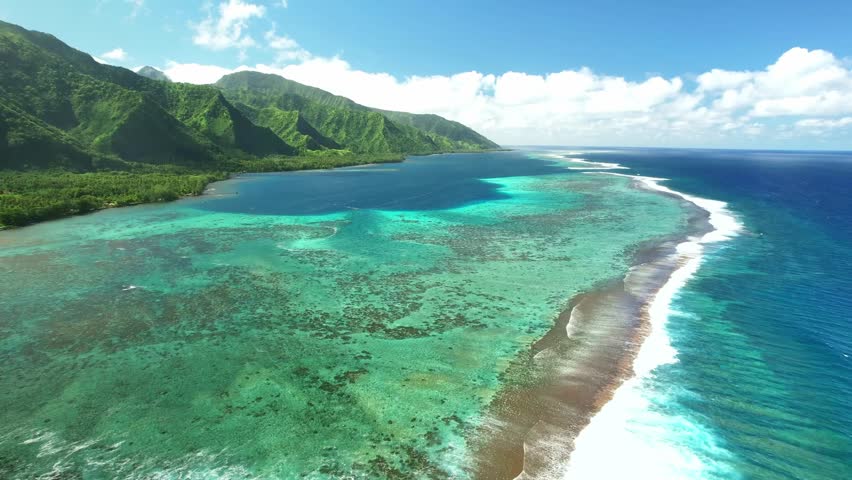 Drone Tahiti. Aerial view of lagoon. Exotic tropical island, ocean, mountains. Aerial view of French Polynesia. Teahupoo is a famous surfing destination. Adventure travel.  Royalty-Free Stock Footage #1109981987