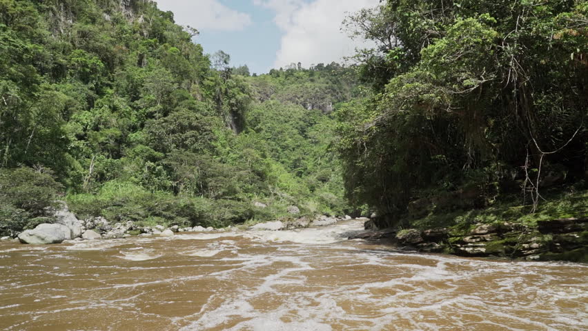 Magdalena river is pressed through a narrow gab at Estrecho de Magdalena, causing whitewater rapids, a popular tourist destination near san agustin in Colombia.