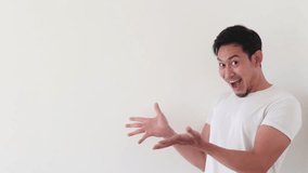 Asian man feels wow and surprised at the empty space for advertisement.