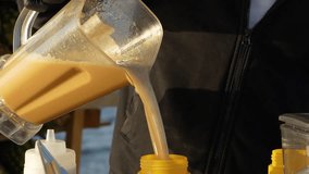 blender. fruit-based drink in a mixer at a seaside kiosk. 4k video, 50 fps.
