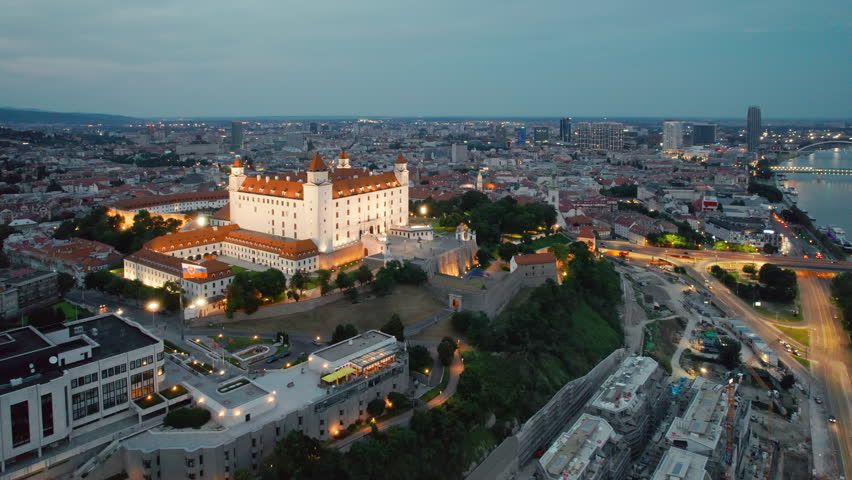 Bratislava cityscape at twilight, Slovakia. Aerial view of the Bratislava castle at night with illumintaion. Bratislavsky Hrad on the hill over Danube river in the capital city of Slovakia.
