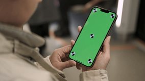 Woman using smartphone with vertical green screen display watching content. Browsing social network, news. Girl in subway using smart phone internet surfing communication online. Public transport - Powered by Shutterstock - Get 15% off with code: PIKWIZARD15