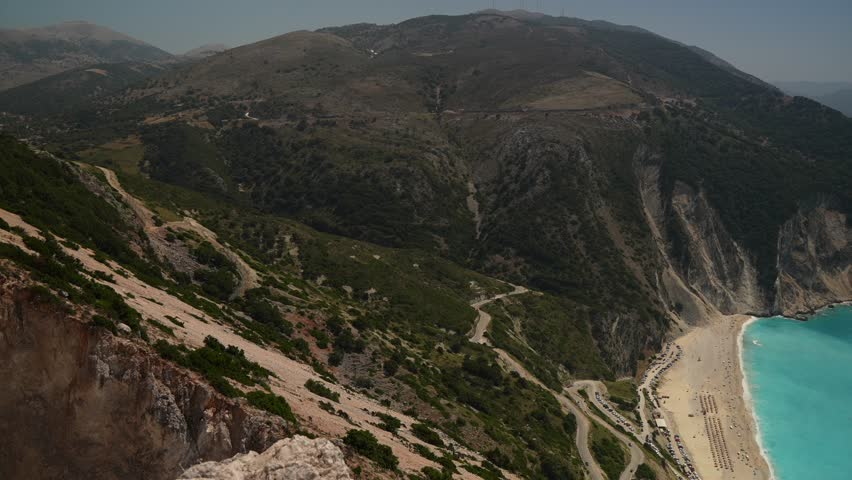 View of turquoise sea and Myrtos Beach from road above, Kefalonia (Cephalonia), Ionian Islands, Greek Islands, Greece, Europe