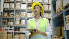 Portrait of asian woman warehouse worker in uniform checks stock and inventory with digital tablet computer, working in delivery, distribution center, logistic and business export - Powered by Shutterstock - Get 15% off with code: PIKWIZARD15