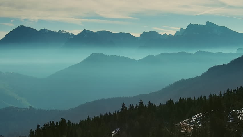 Aerial view of smoky mountains under mist in the morning. Amazing nature scenery in Dolomites, Italy. Tourism and travel concept, 4k