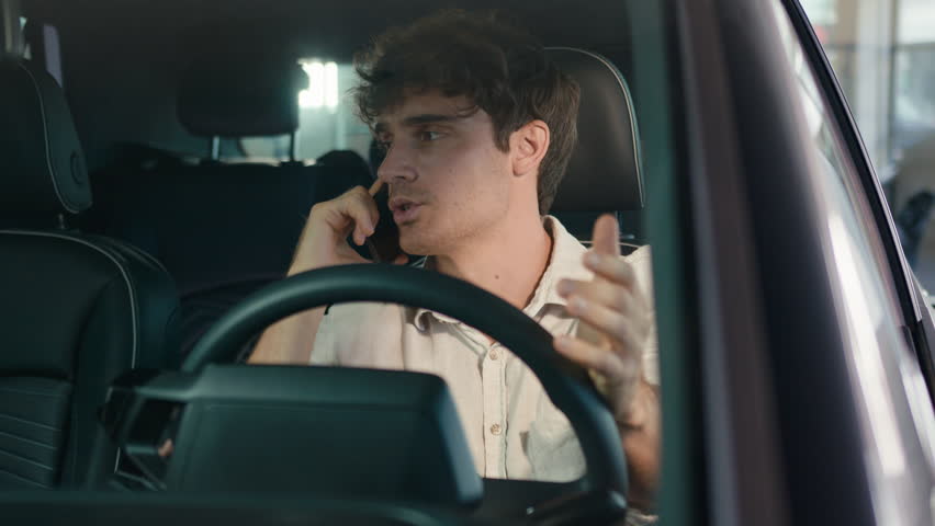 Sad upset frustrated Caucasian man business guy businessman worried male driver in car talking mobile phone speaking smartphone talk unpleasant call negotiation failure quarrel conflict in automobile Royalty-Free Stock Footage #1110014603